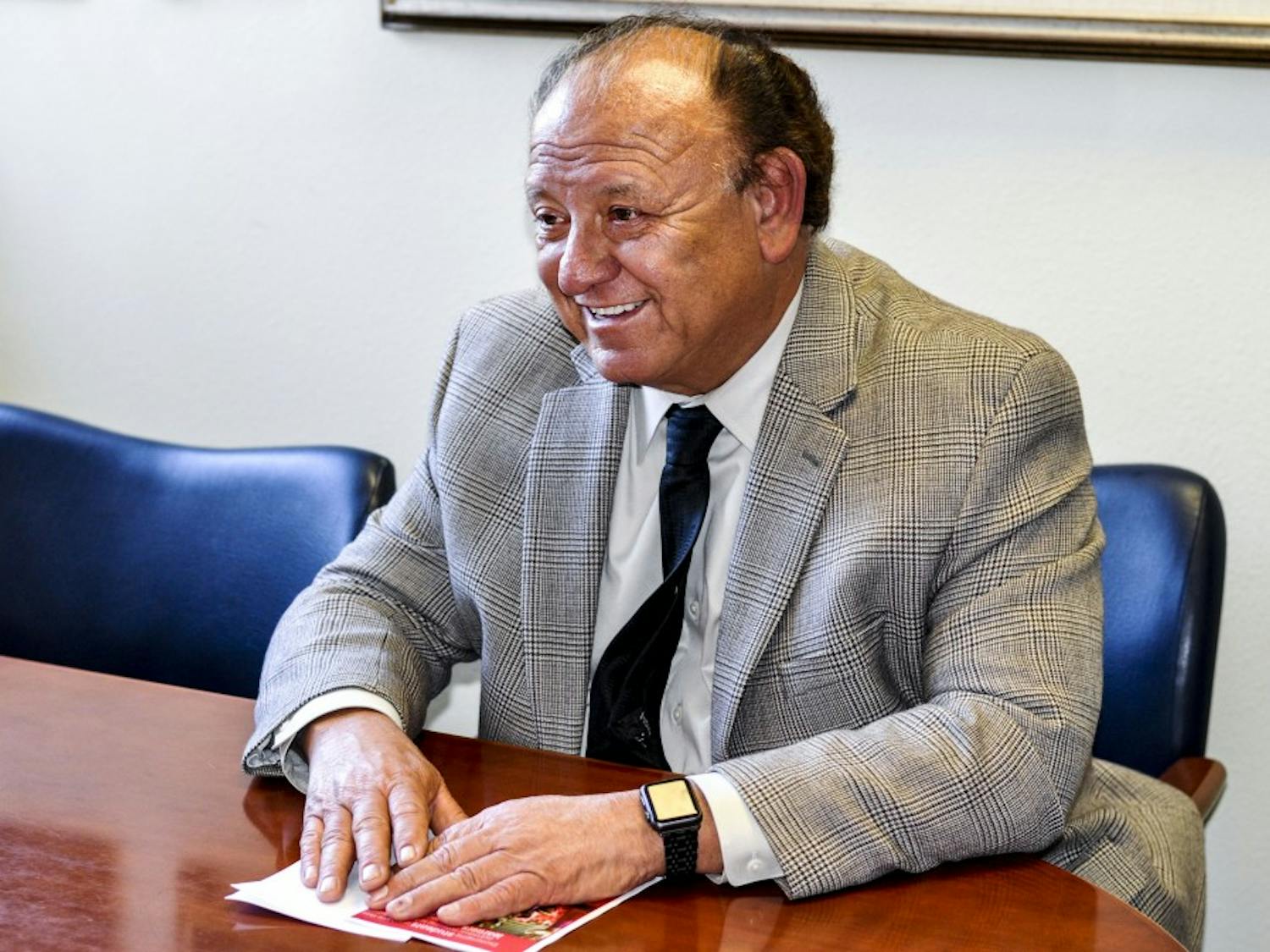 Eliseo “Cheo” Torres smiles during an interview in his office at Scholes Hall on Oct. 31, 2017. Torres was inducted into the Hispanic Association of Colleges and Universities Hall of Champions on Oct. 28, 2017.