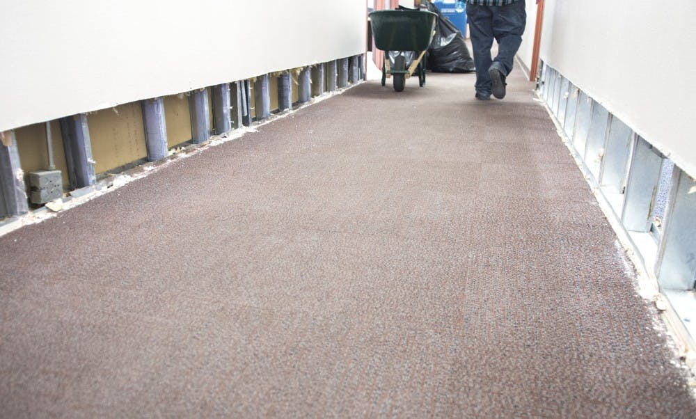 	The walls of the Electrical and Computer Engineering Building are exposed and ready for repair on Wednesday afternoon. Several UNM buildings, including Centennial Library and Hodgin Hall, were damaged during the storm that swept through Albuquerque on Aug. 1.