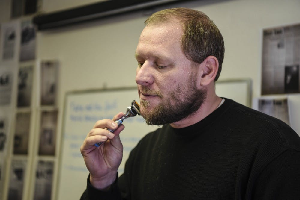 Daily Lobo Sports Editor Robert Maler shaves half his beard after participating in No-Shave November, per the voting results of the Daily Lobo staff on Dec. 3, 2017. Maler hopes his actions will help raise money to buy gifts for the patients at the oncology center at Presbyterian Hospital in Albuquerque.

