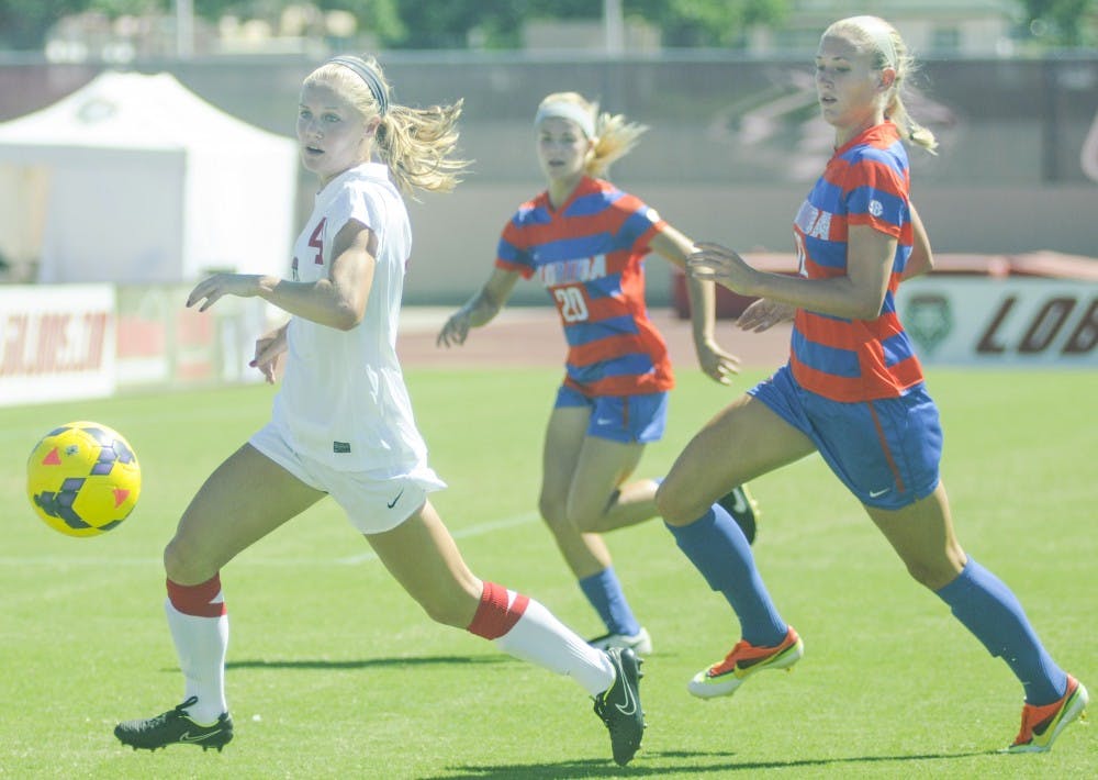 New Mexico midfielder Lindsey Guice steals the ball from New Mexico State players during the soccer game on Friday afternoon. The Lobos defeated NMSU 4-1.