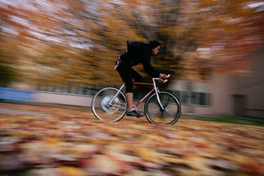 Sau Hsu rides his bike near Clark Hall on Sunday.  