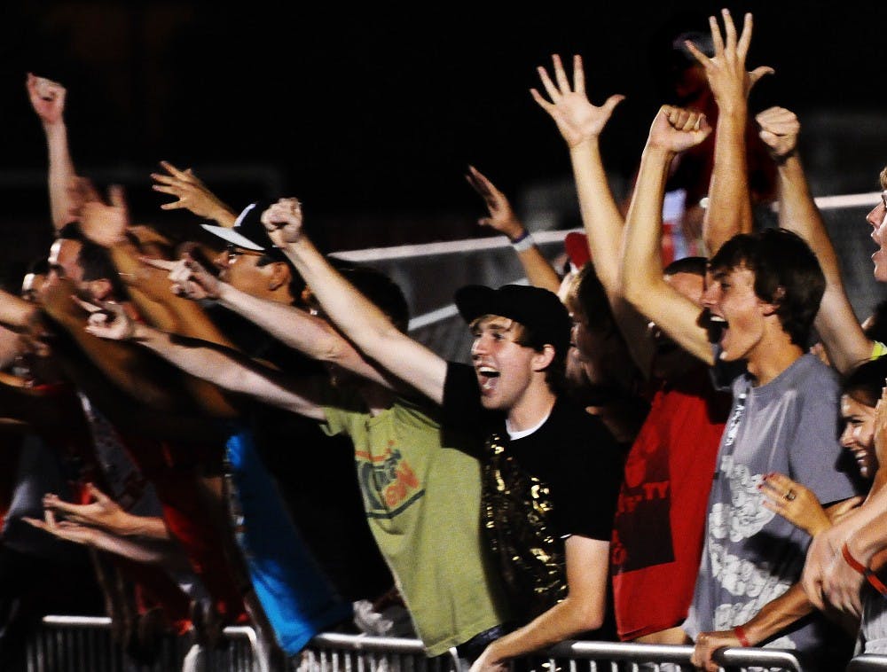 	A rallied group of UNM students shouts distractions to UC-Santa Barbara’s goalie during the Lobos’ Saturday match. The game went into double-overtime and ended in a 1-1 tie. 