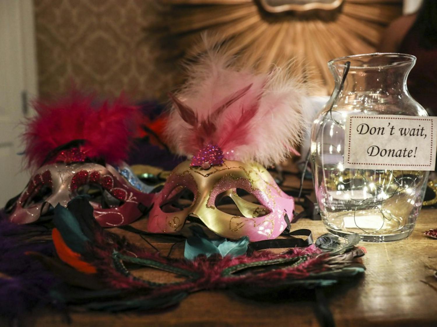 Masquerade masks lay on a table with a donation jar on Saturday evening at Casa Esencia in Old Town. Proceeds benefited One Hope Centro de Vida Health Center and Albuquerque Opportunity Center Clinic.

