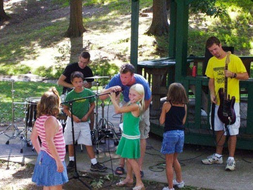Rocky Clay Eagon, center, assists children at rock and roll camp. Eagon and other counselors will start the Musical Institute for Children, a nonprofit organization that will conduct similar camps, including one at Sandia High School June 14-25.