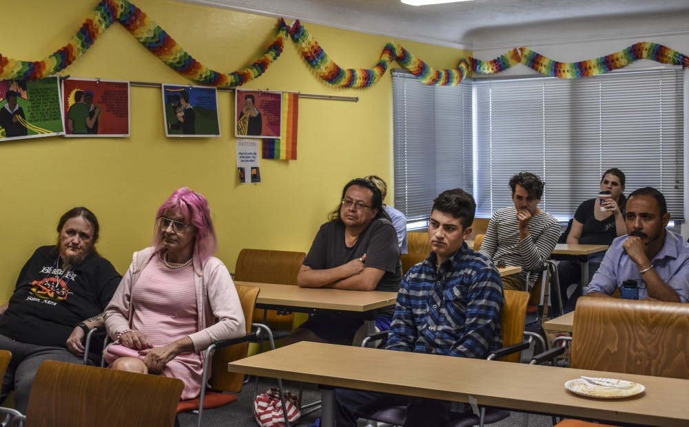 Listeners gather at the UNM LGBTQ resource center to discuss transgender rights.