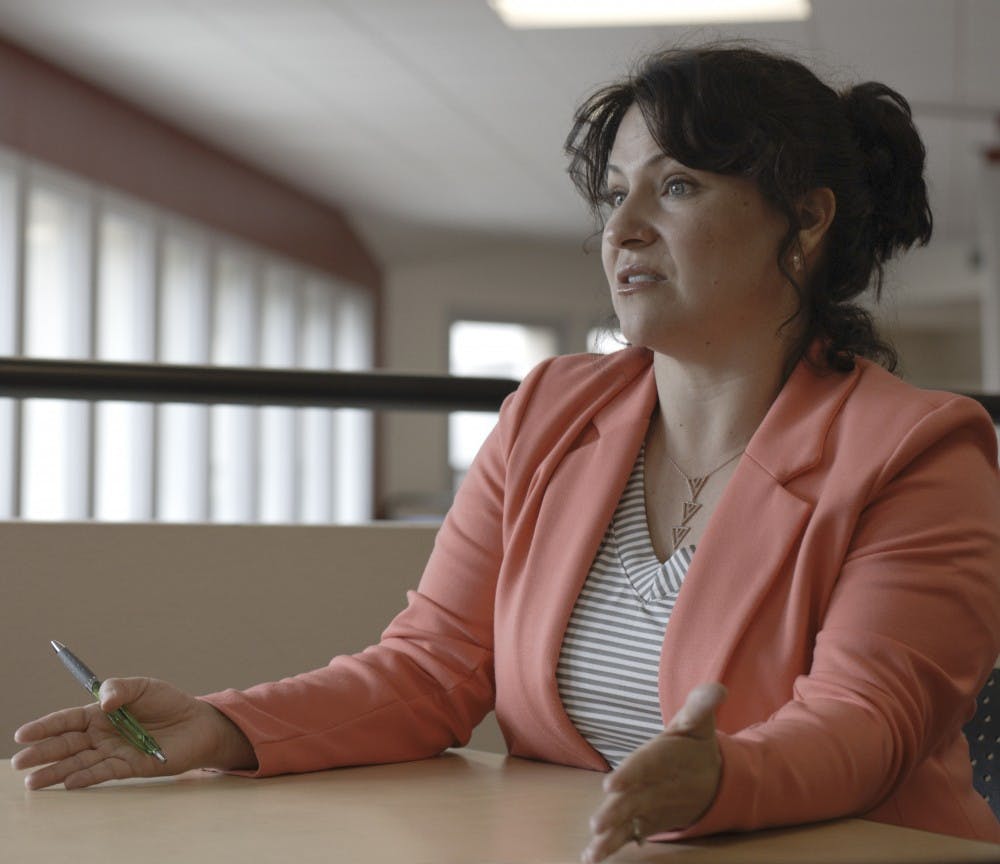 Linda Lindquist explains the outreach work she does with students in New Orleans, Louisiana on Tuesday in Mesa Vista Hall. Lindquist and students call their outreach an Alternative Spring Break where they do things like cleaning horse stalls and gardening. 