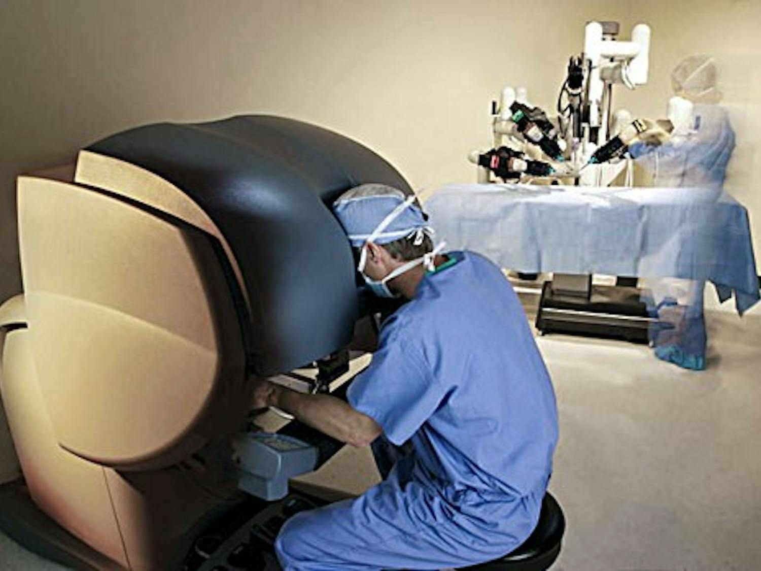 A surgeon demonstrates laparoscopic surgery in this photo illustration. The first ever robotic pediatric surgery was performed at UNM Hospital this summer.