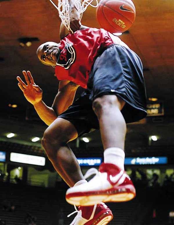 UNM forward Tony Danridge dunks during the Cherry-Silver Games slam dunk competition at The Pit on Oct. 13. After breaking his leg Saturday, Danridge is expected to play in January. 