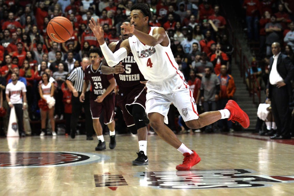 Redshirt sophomore guard Elijah Brown passes the ball down court at WisePies Arena Nov. 13. Brown scored 31 points Sunday night when the Lobos beat the Aggies 83-74.&nbsp;