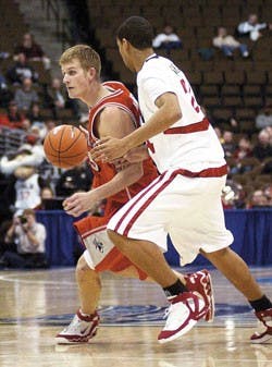Lobo forward Blake Harden dribbles down court during the Lobos' 65-64 loss to UNLV in the Mountain West Conference quarterfinals March 9 in Denver.