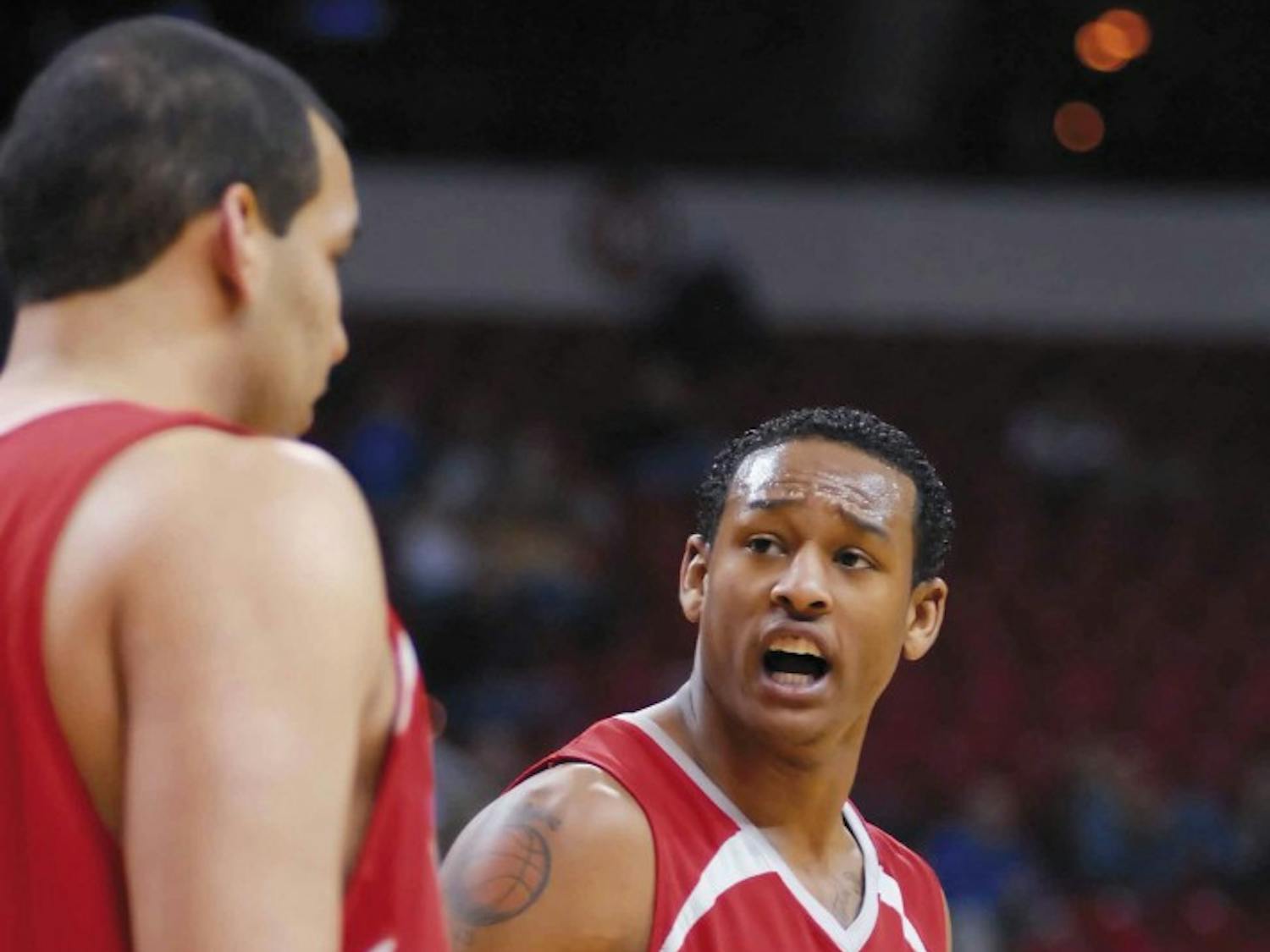 Guard J.R. Giddens argues with forward Aaron Johnson about a play during the last minutes of Tuesday's 62-54 loss to Texas Christian in the play-in game of the Mountain West Conference Tournament in Las Vegas.