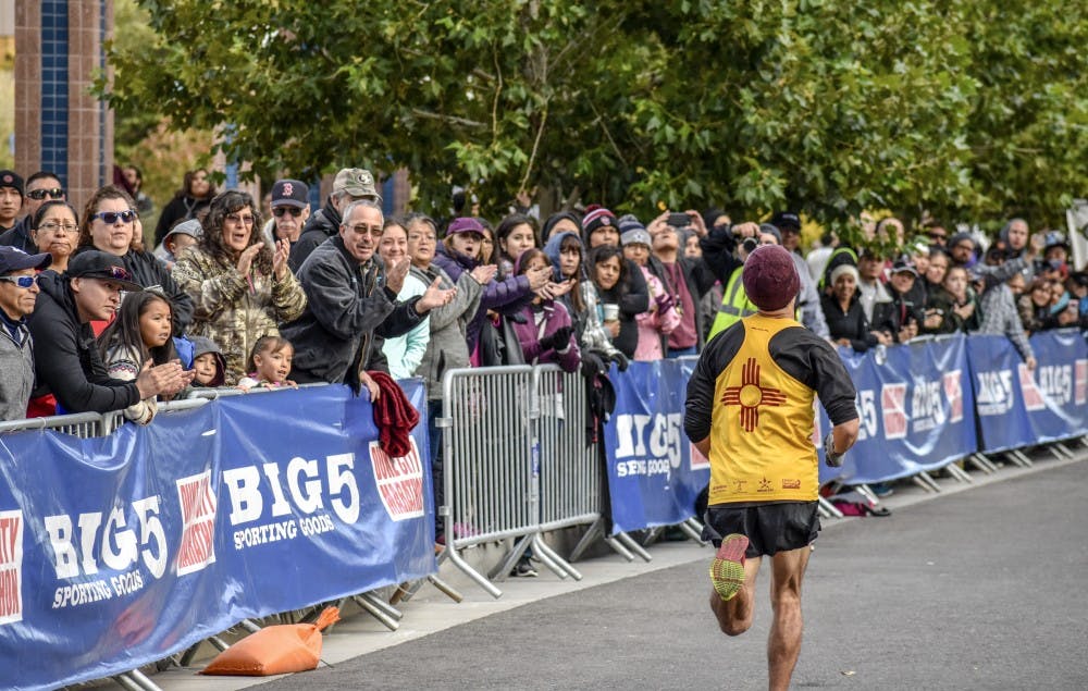 A runner participates in the Duke City Marathon on Sunday, Oct. 20.