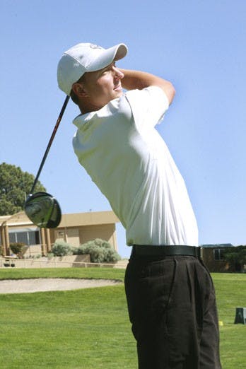 Steve Saunders watches his ball fly through the air during practice on Friday at the UNM Championship Golf Course. Saunders was named 2009 Mountain West Conference Golfer of the Year. He and the Lobos will compete in NCAA Regionals on May 14.