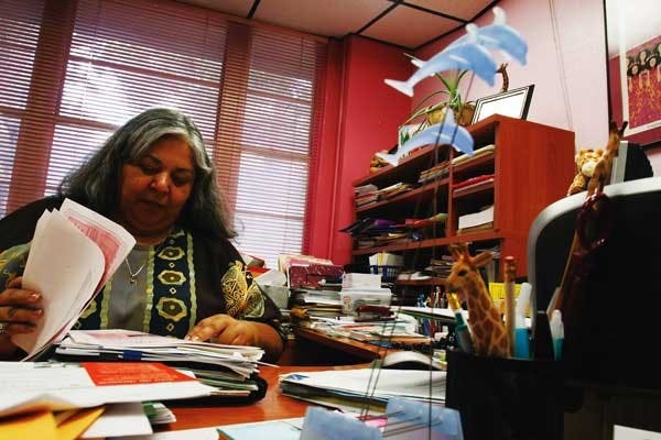 Women's Resource Center Director Sandrea Gonzales works at her desk on Thursday in Mesa Vista Hall. 