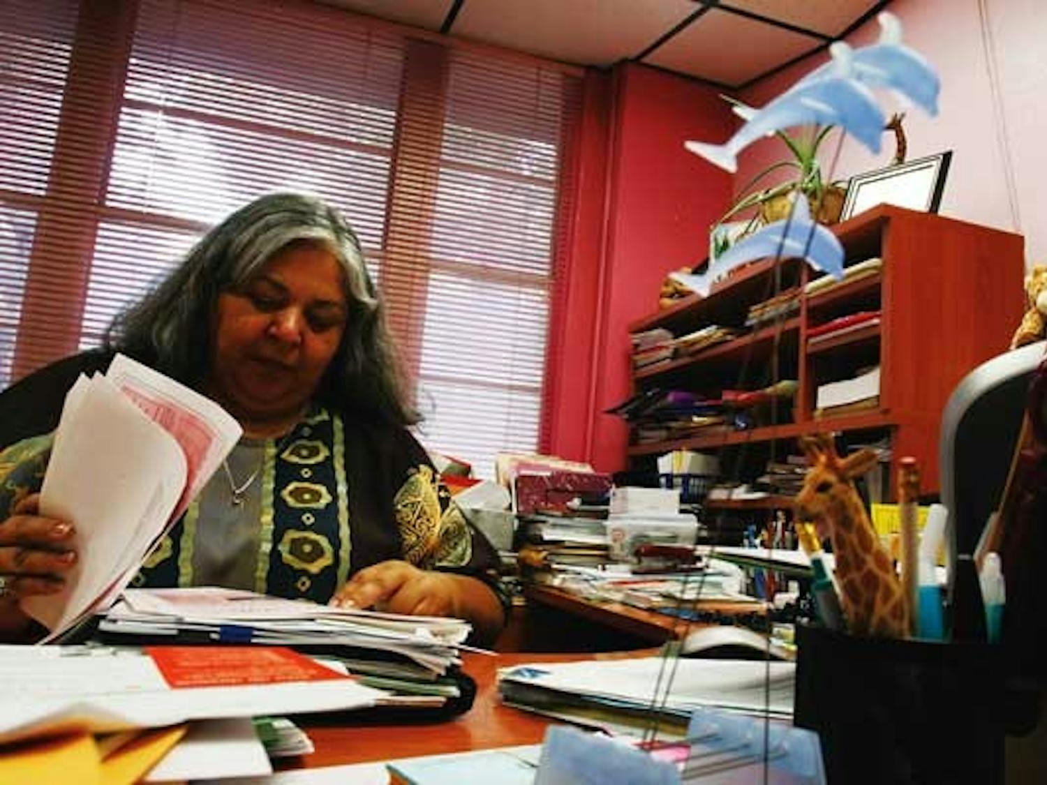 Women's Resource Center Director Sandrea Gonzales works at her desk on Thursday in Mesa Vista Hall.