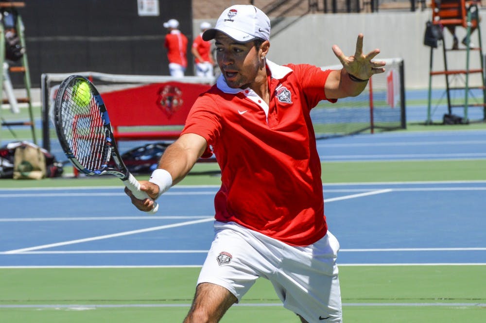 Redshirt junior Rodolfo Jauregui hits the ball back to a Denver player Sunday afternoon at the McKinnon Family Tennis Stadium. The Lobos lost to Denver and will be heading into the Mountain West Championships this week.&nbsp;
