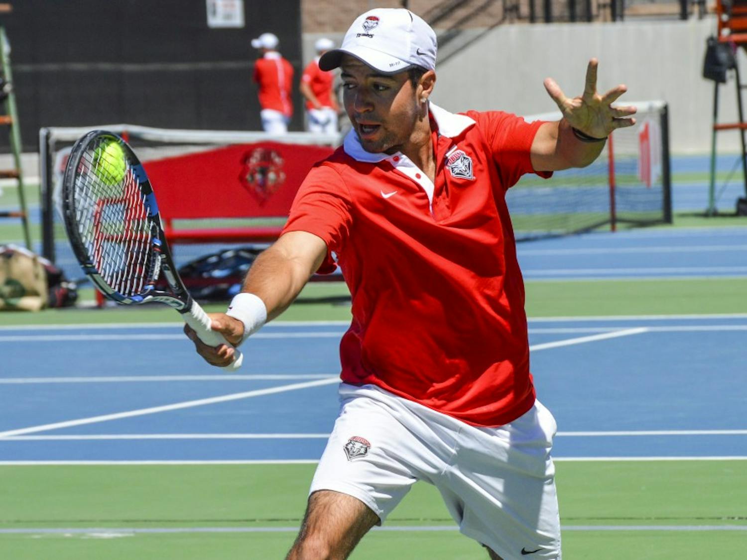 Redshirt junior Rodolfo Jauregui hits the ball back to a Denver player Sunday afternoon at the McKinnon Family Tennis Stadium. The Lobos lost to Denver and will be heading into the Mountain West Championships this week. 