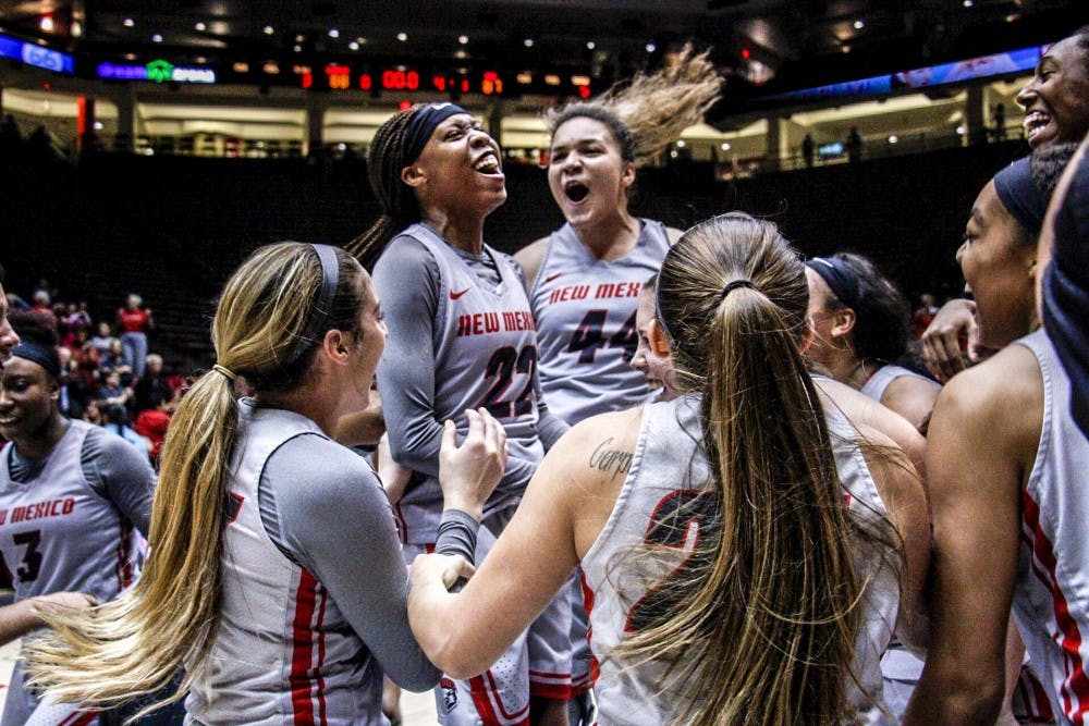 UNM Women's basketball team celebrates after a win against Marquette University on Nov. 13, 2017 at Dreamstyle Arena. The Lobos won 88-87.