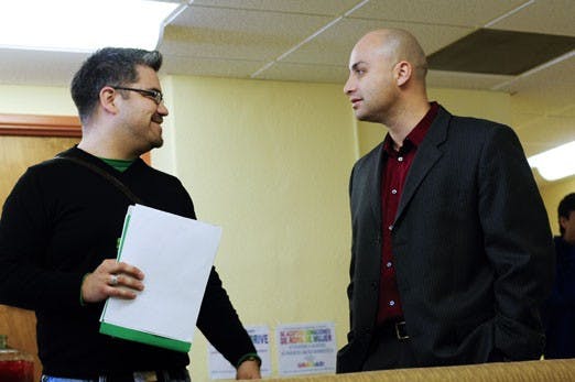 State Auditor Hector Balderas speaks with GPSA President Christopher Ramirez at El Centro de la Raza on Thursday. 