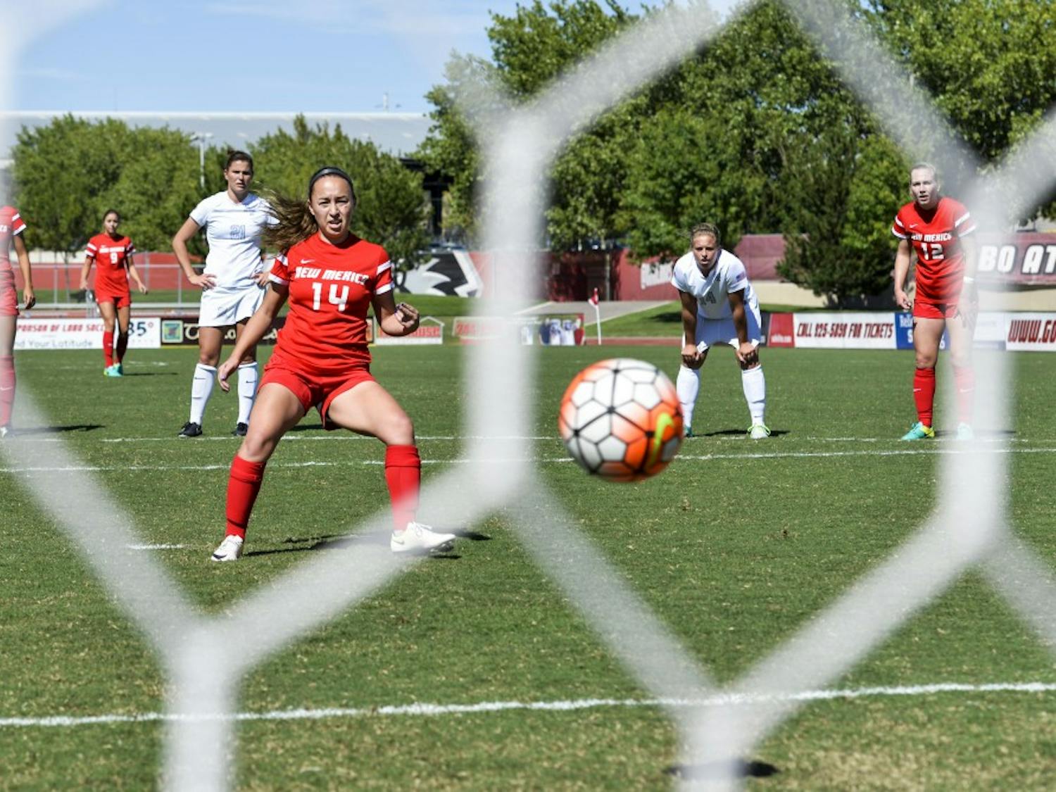 Junior midfielder Claire Lynch fires a penalty shot past a Air Force goal keeper while both teams stand back and watch Sunday Sept. 25, 2016 at the UNM Soccer Complex. The Lobos will compete against San Jose State this Friday.&nbsp;