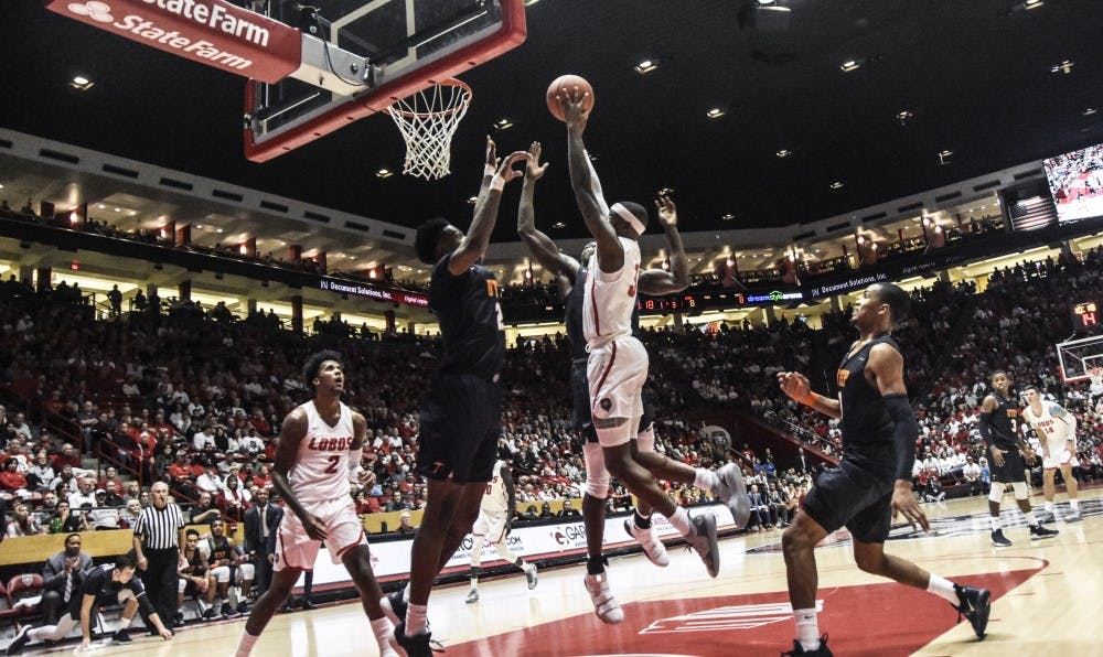 Keith McGee shoots into the air as he attempts to score for UNM this past Saturday. UNM won against UTEP 84-78.