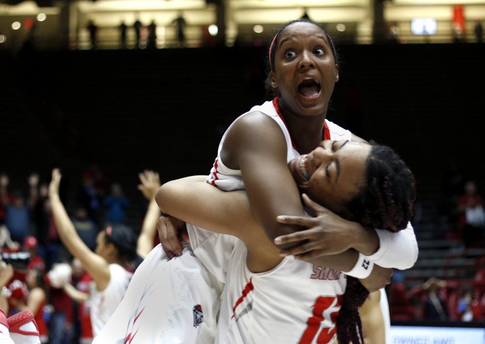 Khadijah Shumpert (right) celebrates along with Bryce Owens&nbsp;Wednesday Feb. 10, 2016 at WisePies Arena. The Lobos beat out Utah State 73-70.