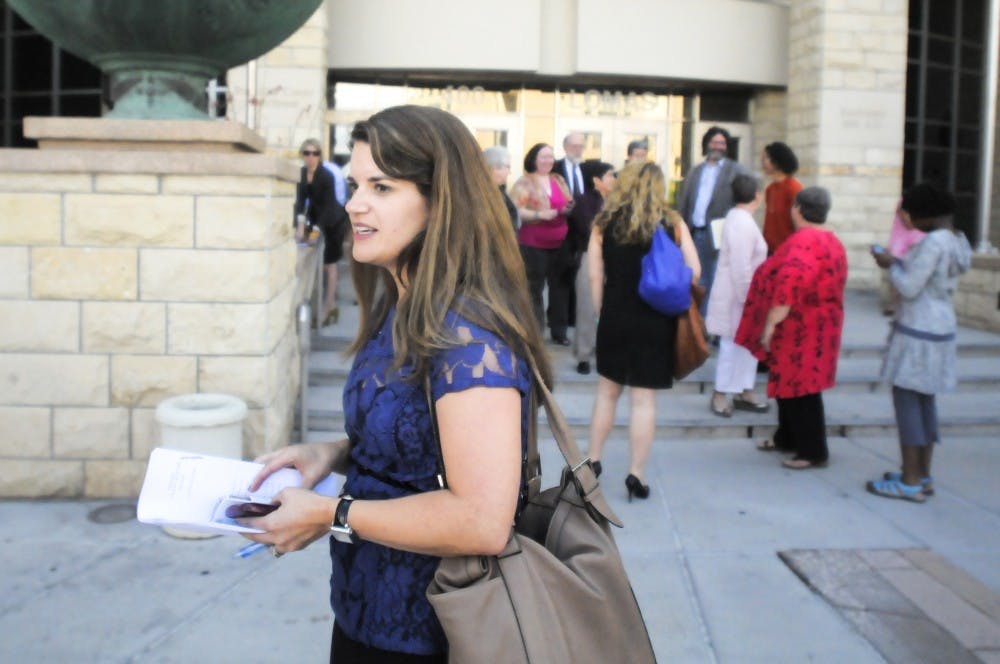	Bernalillo County Clerk Maggie Toulouse Oliver steps outside of the Bernalillo County Courthouse after Bernalillo County Second Judicial District Court ruled in favor of same-sex marriage last year. Oliver was recently named a woman candidate to watch in 2014 by MSNBC.