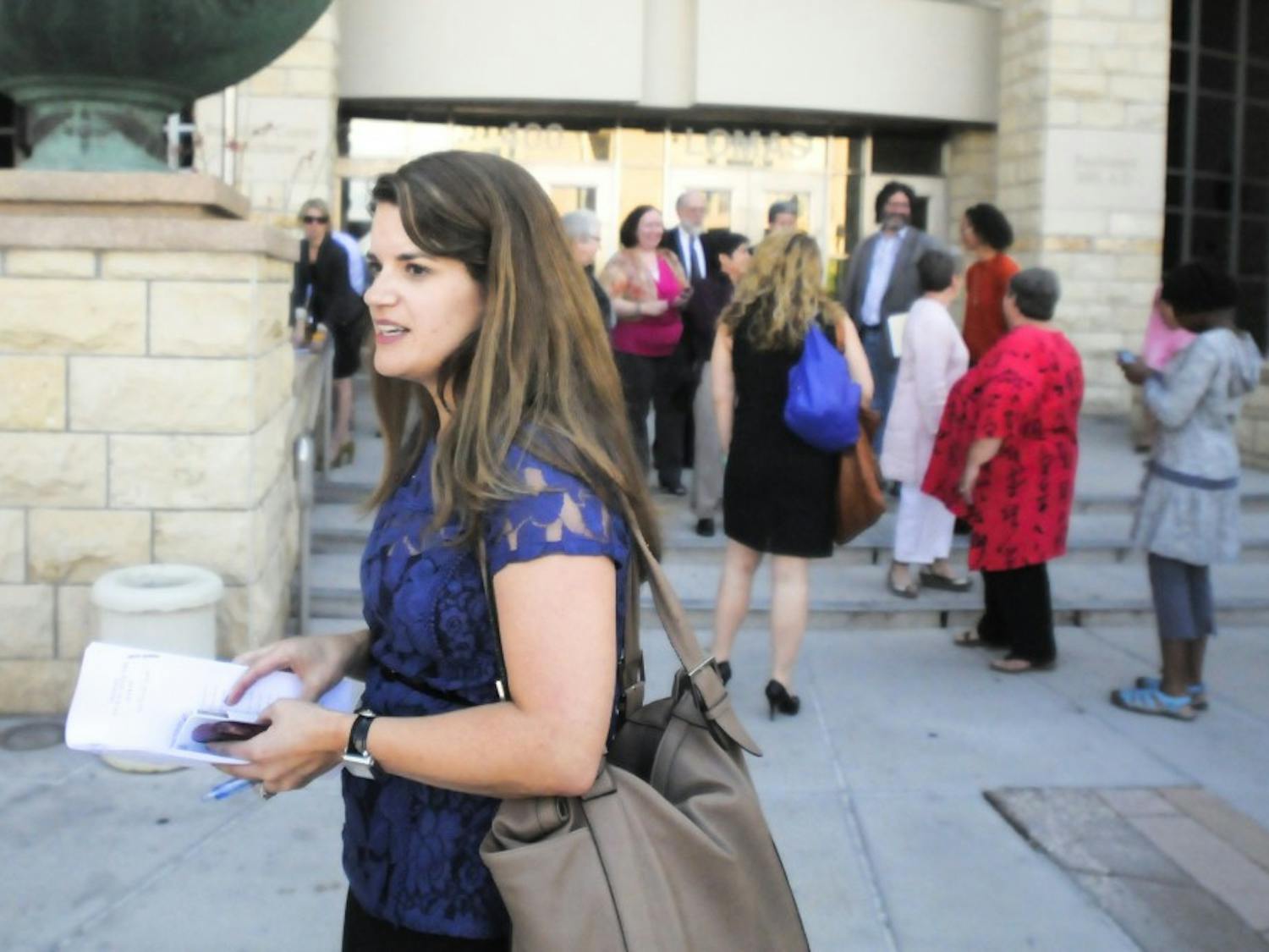 Bernalillo County Clerk Maggie Toulouse Oliver steps outside of the Bernalillo County Courthouse after Bernalillo County Second Judicial District Court ruled in favor of same-sex marriage last year. Oliver was recently named a woman candidate to watch in 2014 by MSNBC.