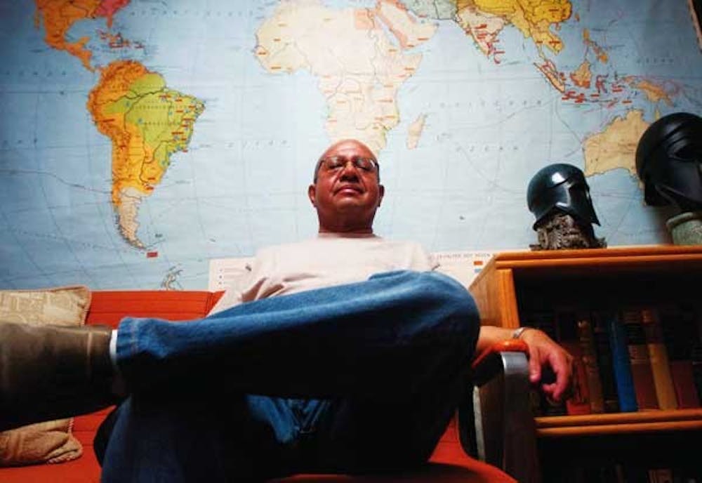 Instructor Charles Truxillo sits in his office in the basement of Chicano Studies on Monday. The program decided not to renew his teaching contract for the spring semester.  