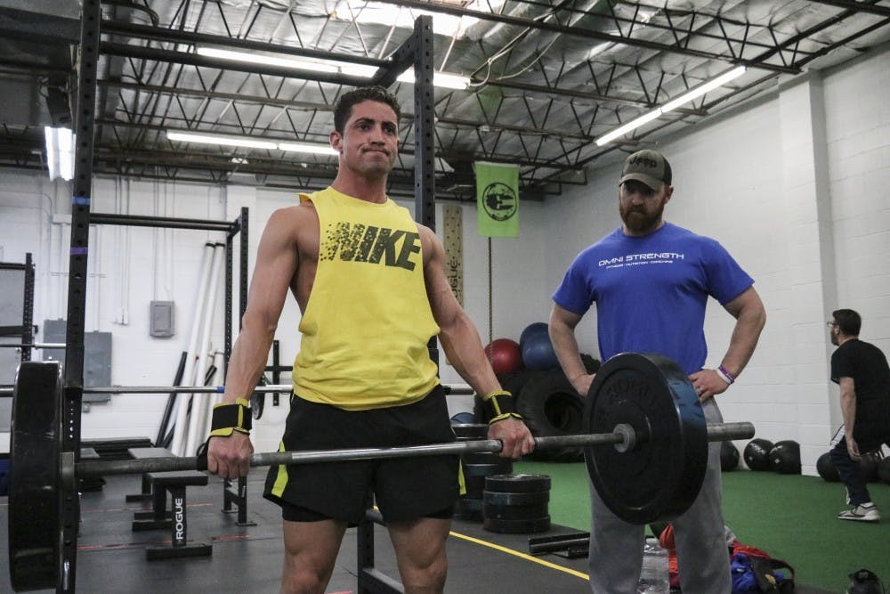 Mike Shields, owner of Omni Strength, trains Duane Yardman-Frank at the Omni Strength gym on Feb. 23, 2018.
