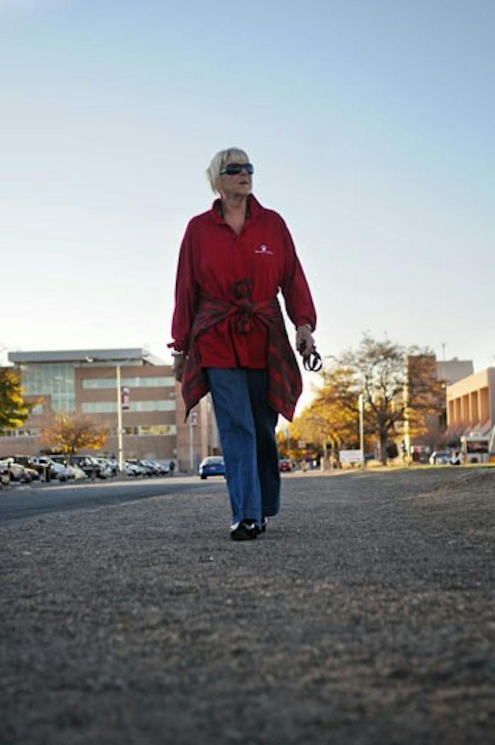 UNM employee Karin Retskin walks around Johnson Field on Tuesday. Retskin is one of 41 employees participating in "Maintain Don't Gain," a nutrition and exercise program sponsored by UNM's Human Resources Division. 