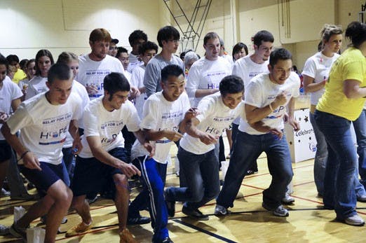 Participants start a race during the Relay for Life on Friday at Johnson South Gym. The American Cancer Society sponsors the event to raise money for patient-support programs and research.
