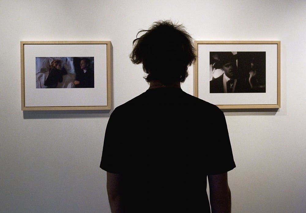 	Student Trahurn Timblin looks at George Richardson’s “Come With Me” at the John Sommers Gallery in the Art Building. Richardson’s exhibit will be on display through Friday.