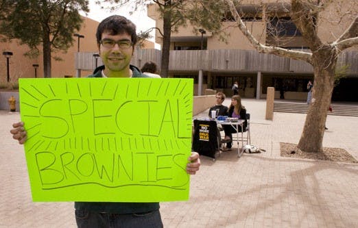 Student Brad Opatz holds a sign in support of the Students for Sensible Drug Policy group at Smith Plaza on Wednesday. The group, which spreads awareness of legislation like the Good Samaritan Law, will meet again Wednesday at 3 p.m. in the SUB.