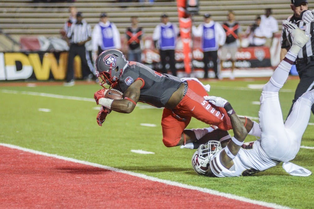 Junior running back Richard McQuarley dives into the Lobos end zone to score a touchdown against ULM Saturday, Oct. 22, 2016 at University Stadium. The Lobos will host Nevada this Saturday at 8:15 p.m..