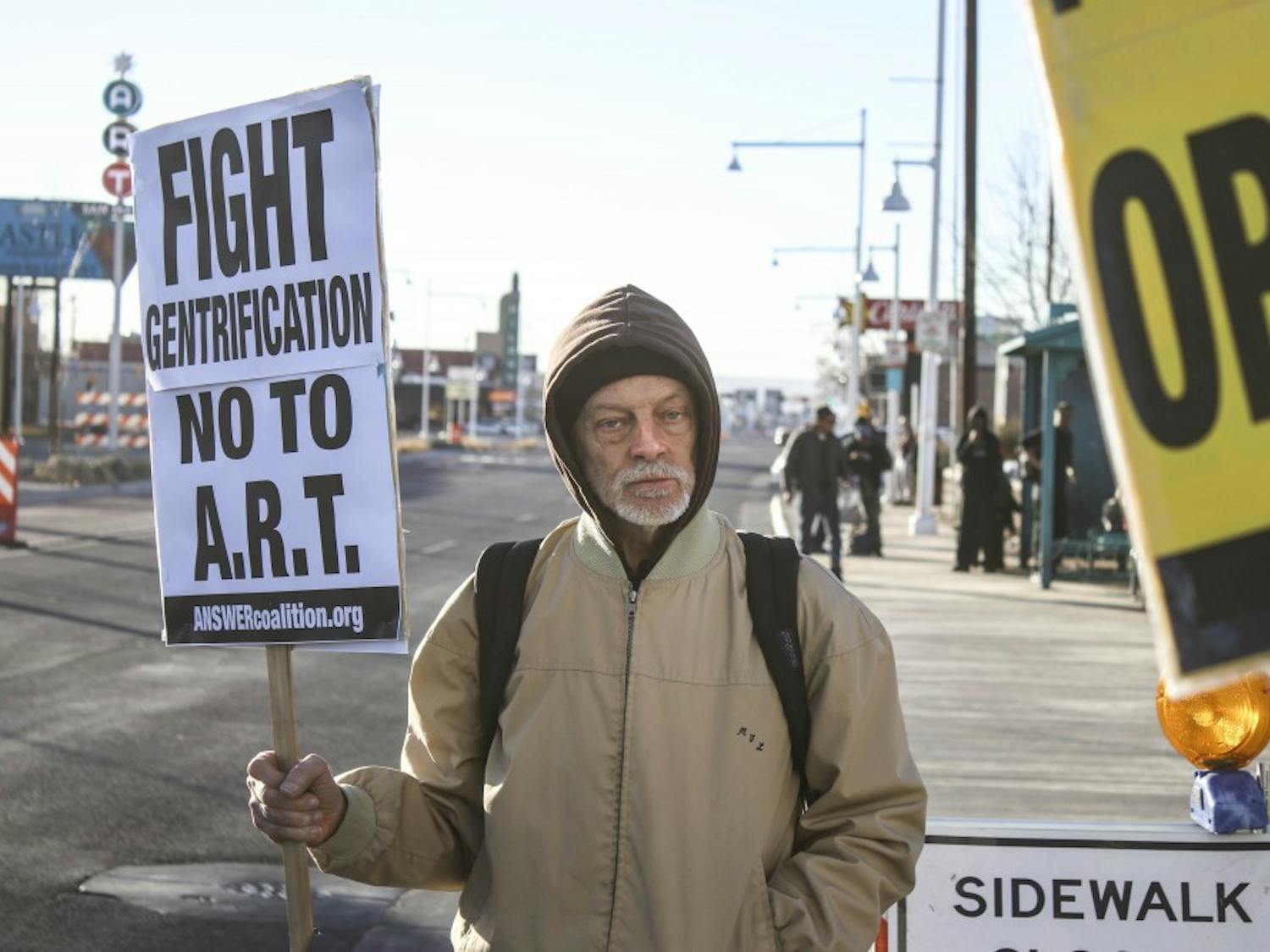 A protester holds an anti-ART sign during the anti-panhandling ordinance protest on the afternoon of Jan. 24, 2017.