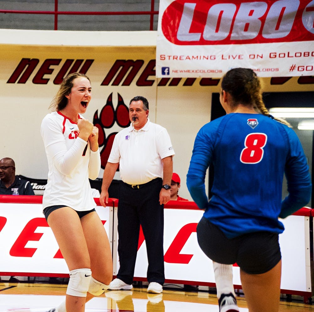 Carson Heilborn (4), sophomore setter, celebrates a kill against the UNM Alumni on Saturday, August 20th at the Johnson Center.