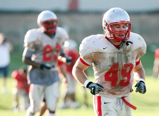 Senior Zach Arnett has overcome his smaller stature to become the Lobos' starting middle linebacker and one of this year's two defensive team captains.