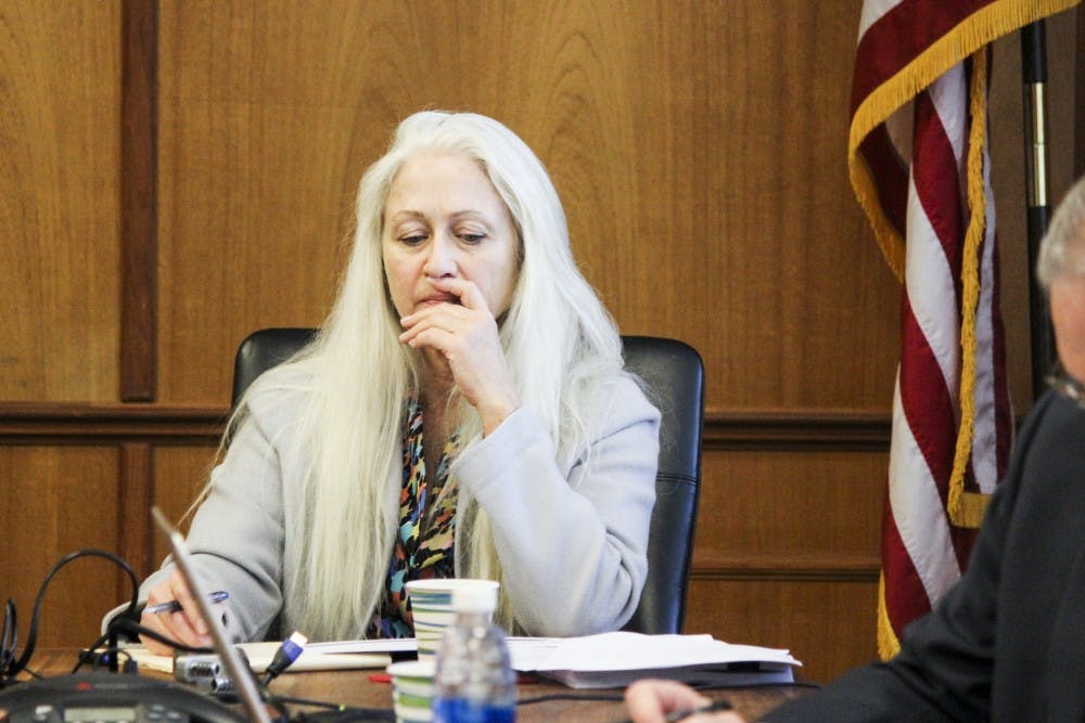 Patrice Martin, executive assistant to Dr. Paul Roth, observes the HSC Committee meeting held at Scholes Hall Tuesday, Oct. 11, 2016. The HSC is undergoing budget cuts that will limit hiring.