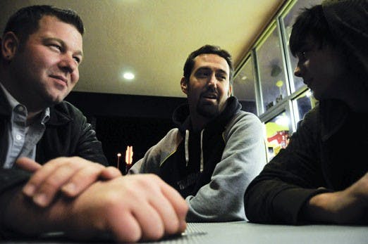 From left: Justin O'Brien, Reverend Mitton and Nic Ortiz y  Pino in front of Which Wich on Harvard on Sunday.