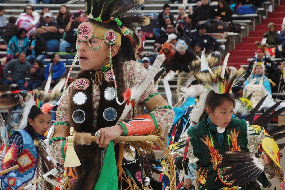 	The Cellicion Zuni Dancers perform at the Gathering of Nations on Friday at University Stadium.