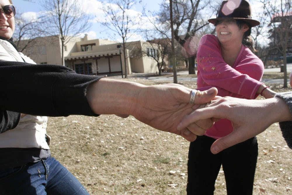 	Students Kristen Krehbiel and Bella Robles perform a dance number February 16 near the Duck Pond for their Image and Movement class. The class will perform another piece called “Interrupted” in front of the Bookstore on Thursday at 8:30 p.m. 