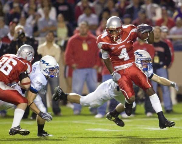 Wide receiver Marcus Smith returns a kickoff during the Lobos 34-31 victory over the Falcons on Thursday at University Stadium.