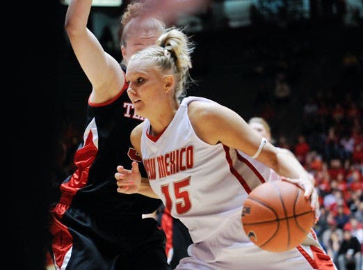Amanda Adamson glides past a Red Raider defender. Adamson recorded her first career double-double, with 10 points and 20 rebounds. 