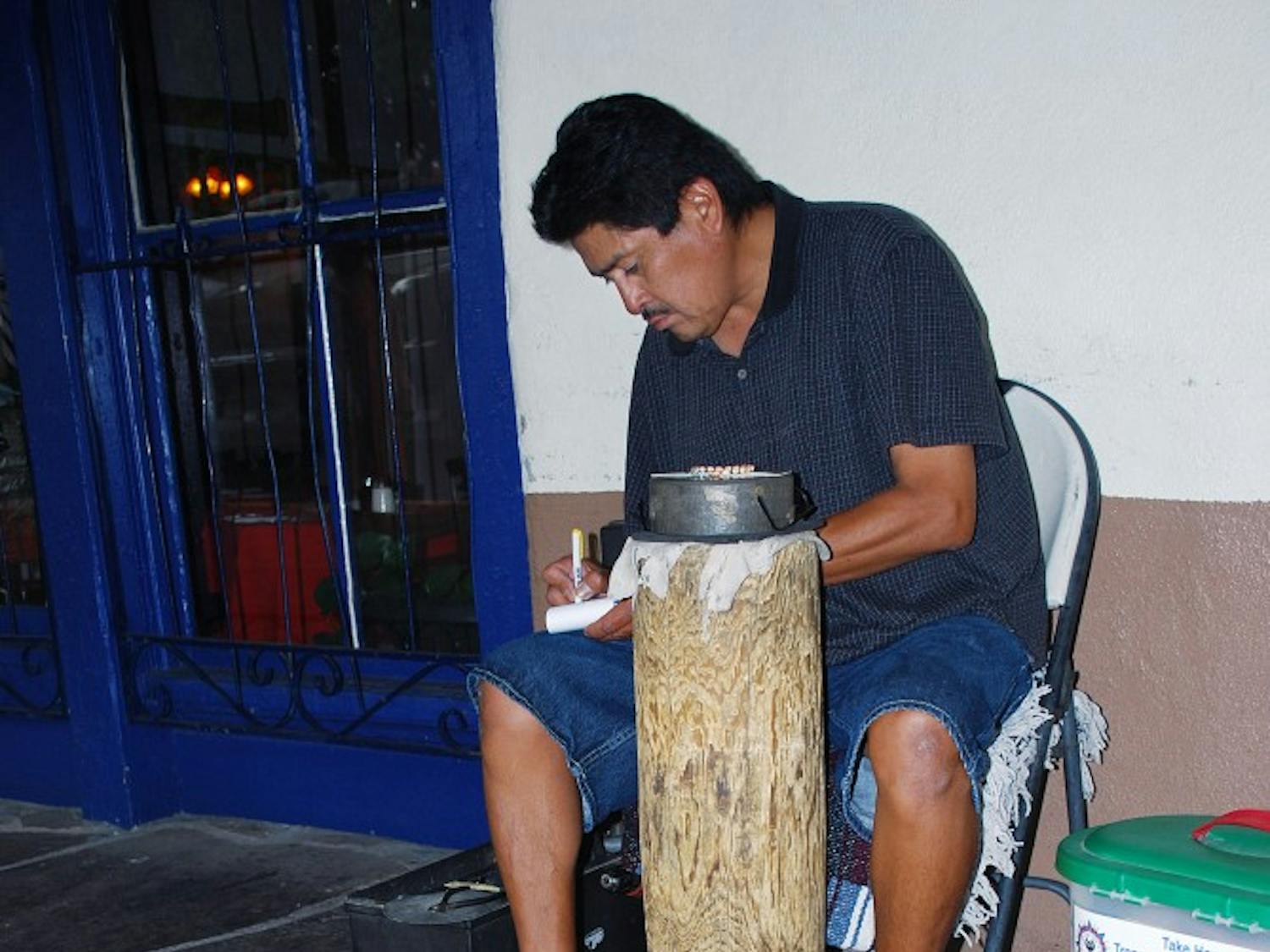 	Curtis Platero works on a jewelry piece in Old Town on July 25. An amendment went into effect on the state Indian Arts and Crafts Amendments Act that reduces the minimum stolen property value required for a felony from $20,000 to $500.