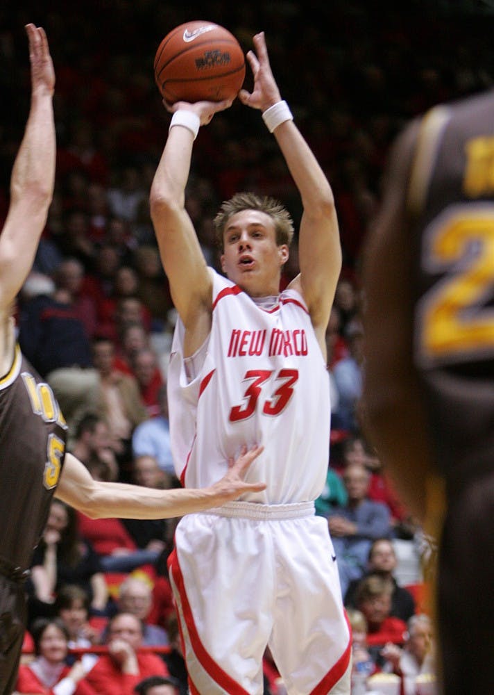 UNM guard Chad Toppert shoots a 3-pointer in the Lobos 100-55 win over Wyoming on Saturday at The Pit.