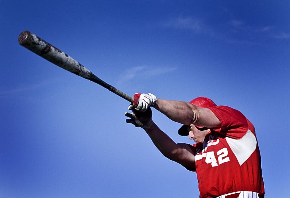 	Freshman outfielder Brian Smith of the UNM baseball team takes a practice swing on deck during Game 3 of the Cherry-Silver World Series at Lobo Field. The Cherry took two of three games from Silver, but Silver won 7-5 on Thursday.