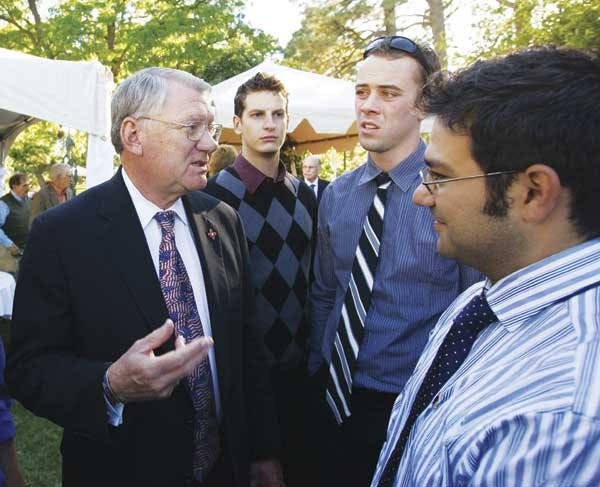 Phi Gamma Delta members from right,  A. Dominic Longoria, Karl Upplegger, and Chris Martin, talk to UNM President David Schmidly at the University House during his inauguration reception Sunday. 