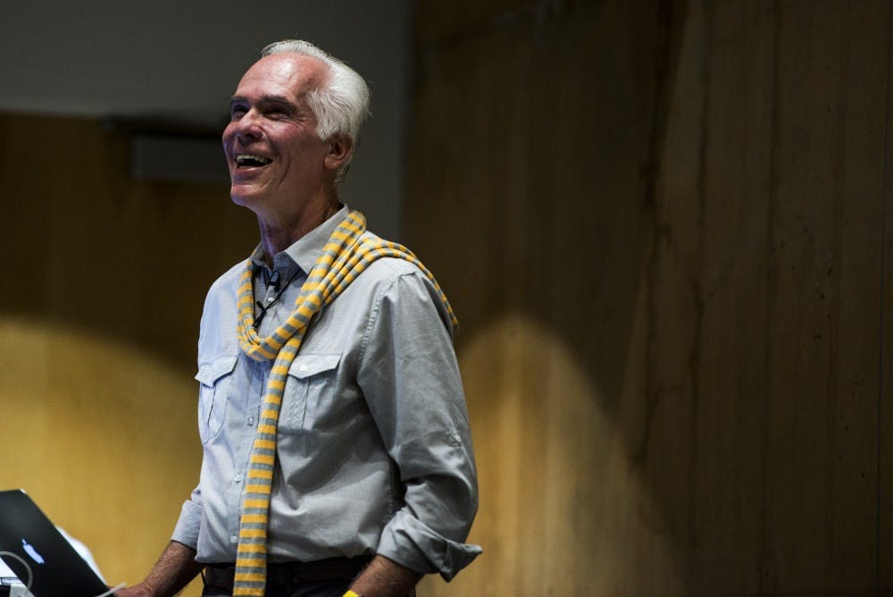 Former Los Angeles District Attorney and current photographer Gil Garcetti laughs with the crowd during his lecture on Thursday, Sept. 15, 2016 at George Pearl Hall. Garcetti spoke about his experience during the OJ Simpson case, and how he is now focusing his time documenting different projects around the world.
