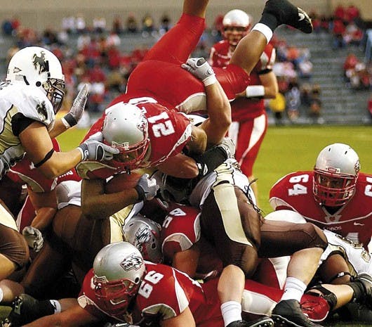 Lobo running back Rodney Ferguson, No. 21, dives over the line of scrimmage into the end zone during the Lobos' 14-10 loss to Wyoming on Saturday at University Stadium.